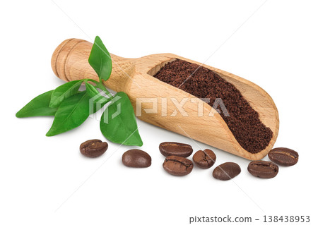 ground coffee in wooden scoop and coffee beans isolated on white background ground coffee in wooden scoop and coffee beans isolated on white background 138438953