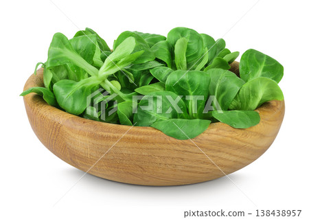 Valerian leaves salad. Corn salad in wooden bowl isolated on white backgrounds. Lettuce salad. 138438957