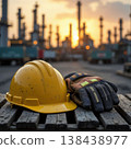 Safety helmet and gloves at refinery during sunset shift 138438977