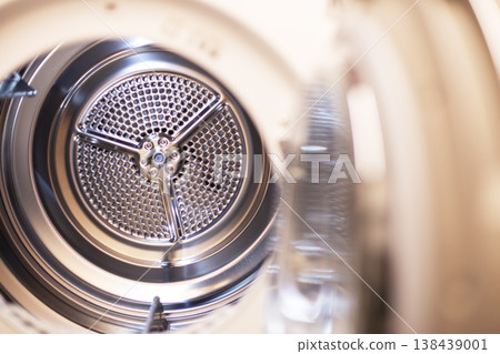 Clean metallic drum inside dryer for laundry tasks Clean metallic drum inside dryer for laundry tasks 138439001