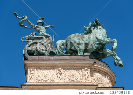 Charioteer with a snake, symbol of War, part of the Millennium Monument on the Heroes Square in Budapest, Hungary Charioteer with a snake, symbol of War, part of the Millennium Monument on the Heroes Square in Budapest, Hungary 138439158