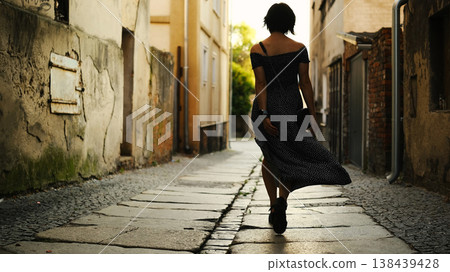 Attractive Young Woman Walks Through The Historical Part Of A European City, Happy Girl Tourist Enjoys Sightseeing In The Center 138439428