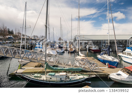 Edmonds, Marina Beach Park, WA, 03.13.2025 - General view of moored boats on the water and multi-level parking on the shore Edmonds, Marina Beach Park, WA, 03.13.2025 - General view of moored boats on the water and multi-level parking on the shore 138439932