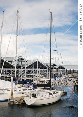 Edmonds, Marina Beach Park, WA, 03.13.2025 - A close-up view of yachts moored in the parking lot vertical photo Edmonds, Marina Beach Park, WA, 03.13.2025 - A close-up view of yachts moored in the parking lot vertical photo 138439952
