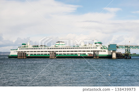 Edmonds, Marina Beach Park, WA, 03.13.2025 - a ferry standing at the pier where cars are loaded Edmonds, Marina Beach Park, WA, 03.13.2025 - a ferry standing at the pier where cars are loaded 138439973