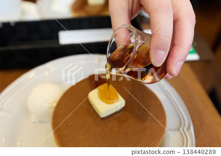 pour syrup on hotcakes pour syrup on hotcakes 138440289