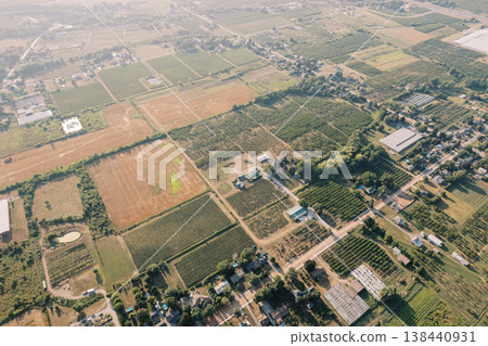 Scenic aerial view of cultivated fields and rural infrastructure 138440931