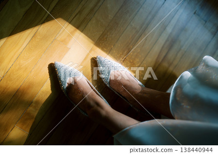Sophisticated Footwear Sparkles In Sunlight Over Glossy Wooden Floor Sophisticated Footwear Sparkles In Sunlight Over Glossy Wooden Floor 138440944