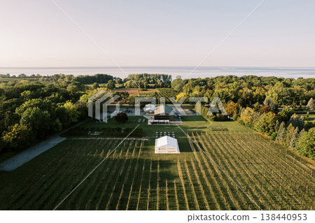 Beautifully Decorated Tents Overlooking Water During Sunset Beautifully Decorated Tents Overlooking Water During Sunset 138440953