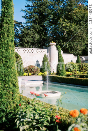 Aesthetic Water Feature Surrounded By Thriving Greenery 138440978