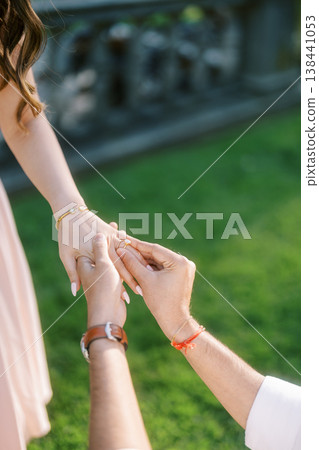 Intimate Proposal Captured With Detailed Jewelry And Lush Background 138441053