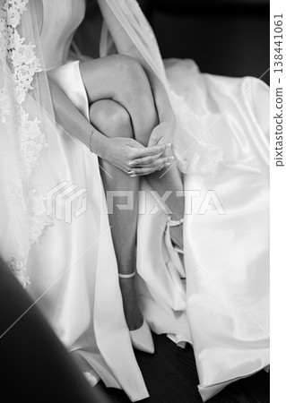 Caucasian Bride Fastening Garter Black and White Caucasian Bride Fastening Garter Black and White 138441061