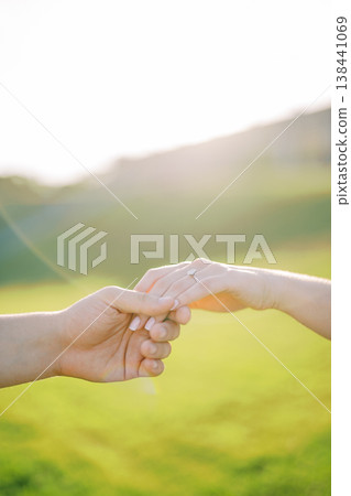 Closeup Of Hands With Engagement Ring Shining Brightly Closeup Of Hands With Engagement Ring Shining Brightly 138441069