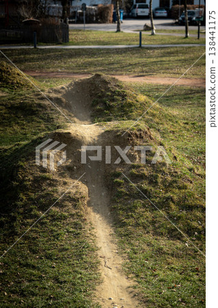 Dirt Mountain Bike Trail In Emmering: Small Pump Track Path Across Grass Meadow In Bavarian Countryside Dirt Mountain Bike Trail In Emmering: Small Pump Track Path Across Grass Meadow In Bavarian Countryside 138441175