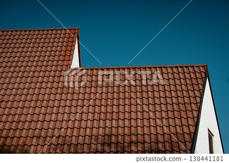 Red Clay Tiled Roof Against Blue Sky: Minimal Architectural Detail Of Traditional Bavarian House 138441181