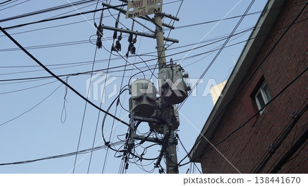 Electric pole and transformers in a residential area in Seoul, Korea. Electric pole and transformers in a residential area in Seoul, Korea. 138441670