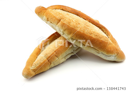 Two fresh loaves of bread stacked on white background 138441743