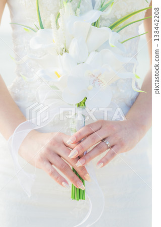 Bride with a bouquet at the wedding Bride with a bouquet at the wedding 138442208