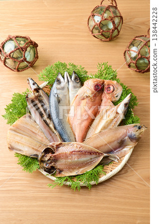 Various kinds of dried fish arranged on a sieve Various kinds of dried fish arranged on a sieve 138442228
