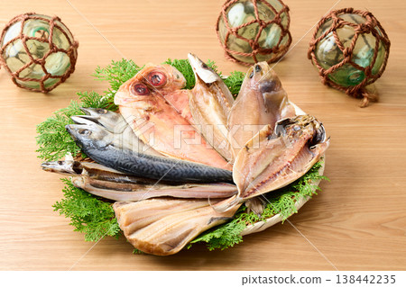 Various kinds of dried fish arranged on a sieve 138442235