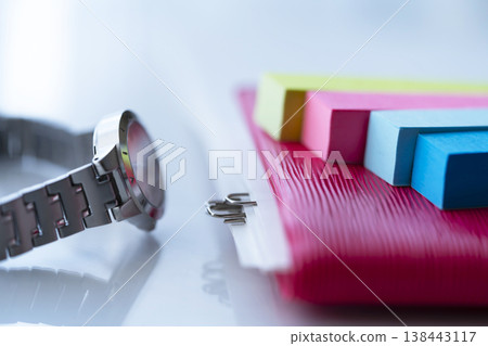 A notebook and a watch on the table A notebook and a watch on the table 138443117