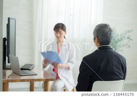 Doctor examining a senior man Doctor examining a senior man 138443170