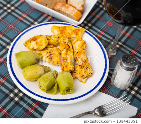 Grilled chicken breast with artichokes, healthy dinner Grilled chicken breast with artichokes, healthy dinner 138443351