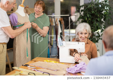 Group of elderly people at sewing master class Group of elderly people at sewing master class 138443437