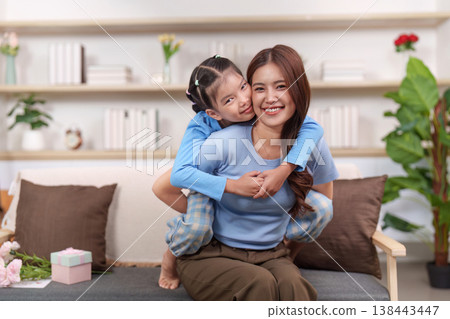 Mother and daughter enjoying playful time together Mother and daughter enjoying playful time together 138443447