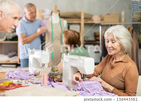Group of senior learners enjoying sewing class in workshop Group of senior learners enjoying sewing class in workshop 138443561