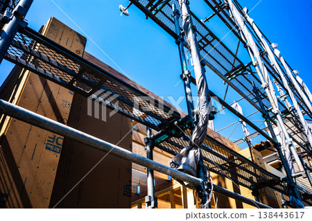 House under construction with scaffolding erected a-2 High contrast 138443617