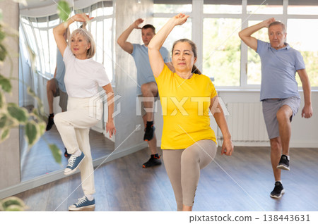 Elderly woman dances modern dances in group 138443631