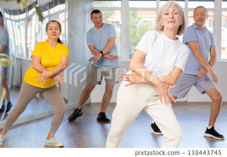Elderly woman dances modern dances in group 138443745