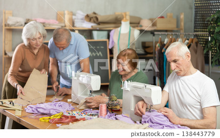 Group of senior learners enjoying sewing class in workshop Group of senior learners enjoying sewing class in workshop 138443779
