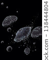 A pointillist illustration of round jellyfish and bubbles floating in the deep sea (on a jet-black background). 138444804