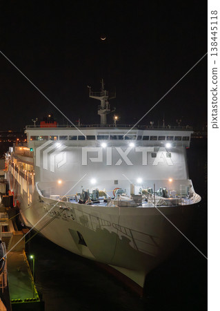 A ferry at night and a crescent moon A ferry at night and a crescent moon 138445118