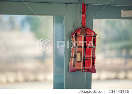 A tote bag hanging inside the car A tote bag hanging inside the car 138445226