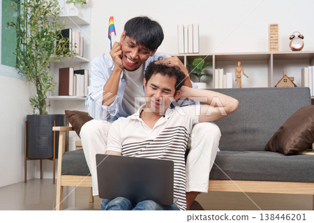 LGBTQ couple sharing a moment with a laptop 138446201