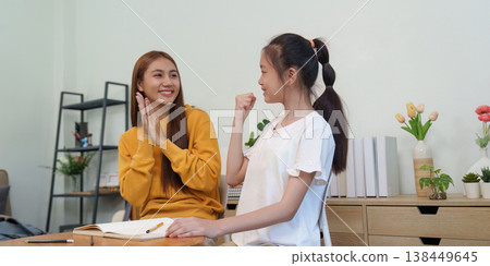 Mother and daughter preparing for school together Mother and daughter preparing for school together 138449645