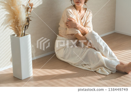 A woman by the window in the setting sun (model, fashion, light, shadow) 138449749