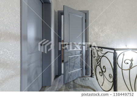 Modern Classic Hallway with Grey Doors and Wrought Iron Railings Modern Classic Hallway with Grey Doors and Wrought Iron Railings 138449752