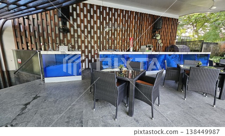 tables and chairs in restaurant 138449987