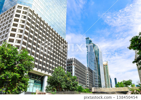 A cityscape with greenery and buildings 138450454