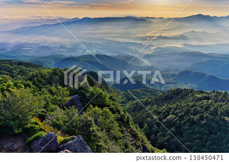Mountain range shrouded in morning mist, as seen from Nyū in the northern Yatsugatake Mountains. Mountain range shrouded in morning mist, as seen from Nyū in the northern Yatsugatake Mountains. 138450471