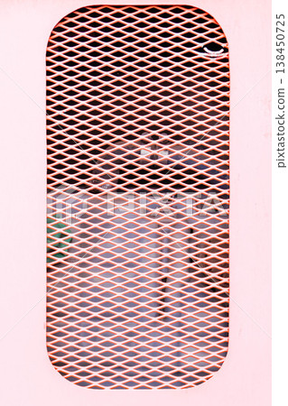 Red metal mesh. Hatch with ventilation metal mesh of the expansion barrel compartment of the bus cooling system. High quality photo Red metal mesh. Hatch with ventilation metal mesh of the expansion barrel compartment of the bus cooling system. High quality photo 138450725