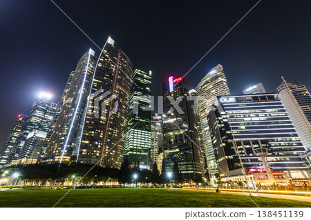 Night view of the Marina Bay Financial Centre and the Raffles Place modern office skyscrapers along Marina Bay in Singapore.  138451139