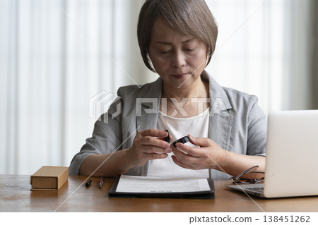 Senior woman hesitant to sign and seal contract - negative 138451262