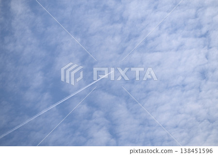 Spring clouds and contrails Spring clouds and contrails 138451596
