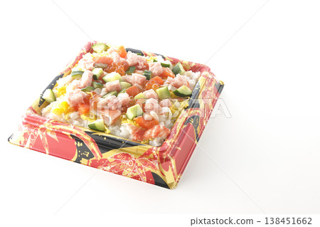 A photo of a generously topped chirashi sushi against a white background. A photo of a generously topped chirashi sushi against a white background. 138451662