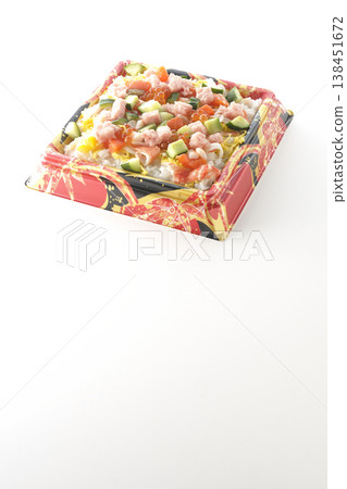A photo of a generously topped chirashi sushi against a white background. A photo of a generously topped chirashi sushi against a white background. 138451672
